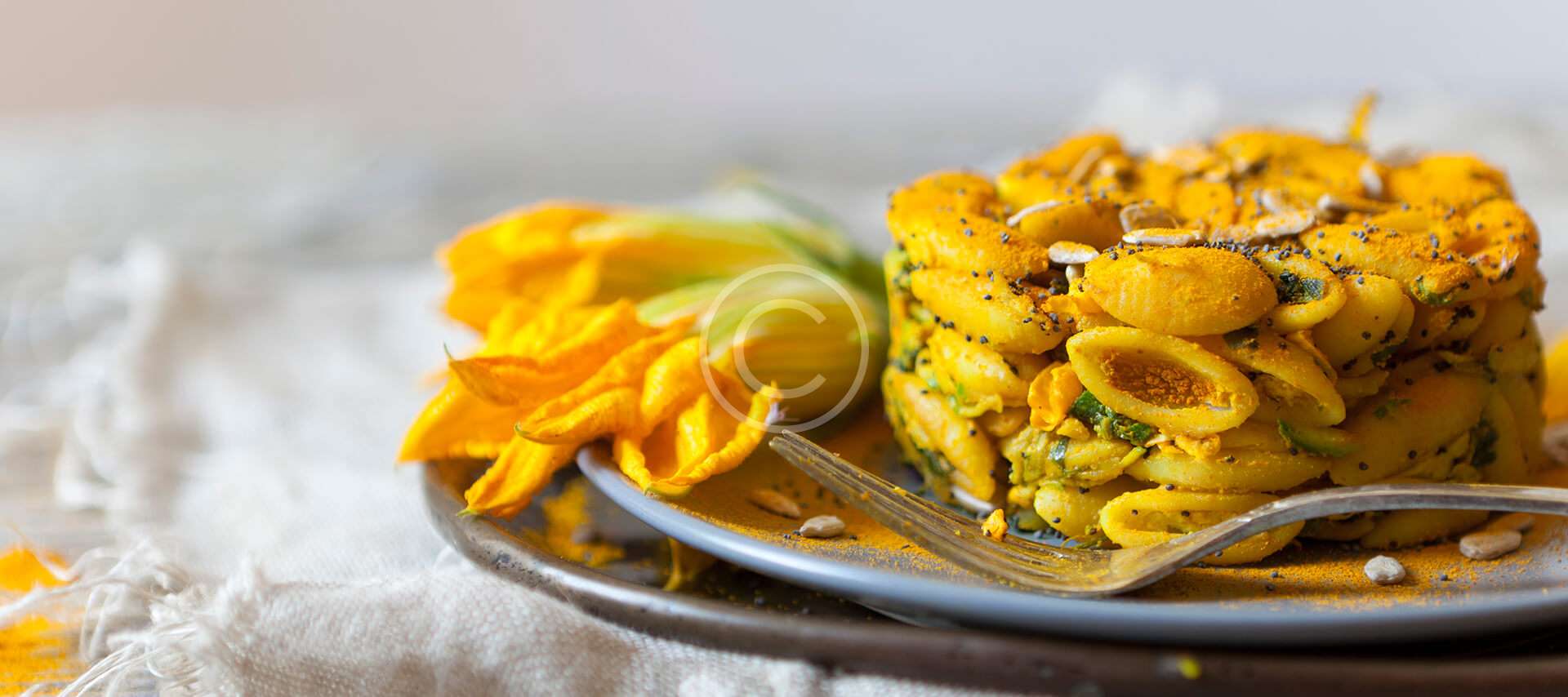 Pasta with zucchini blossom and saffron sauce